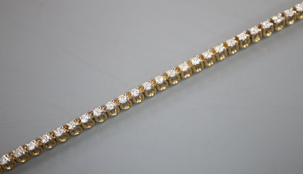 A modern 9ct gold and diamond set line bracelet, 17.7cm, gross 7 grams,